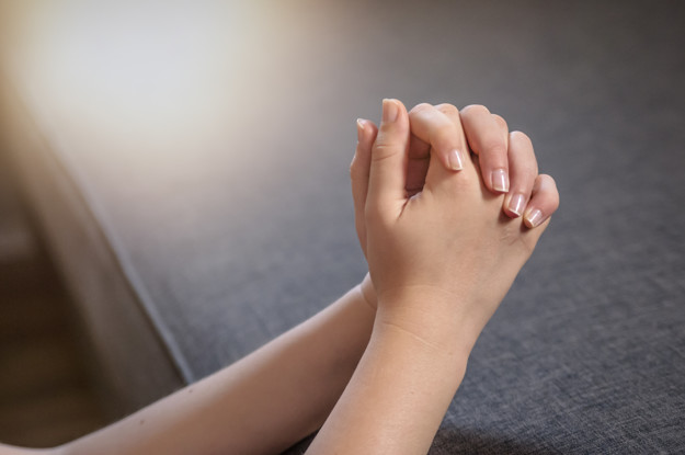 Pray in the Morning , Woman praying with hands together Pray in the Morning , Woman praying with hands together. Unrecognizable woman praying, hands clasped together